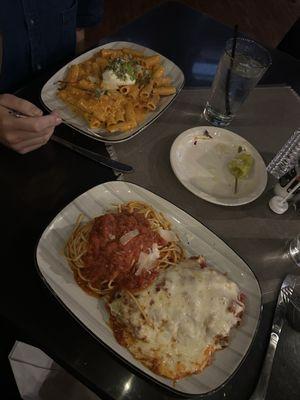 Penne alla vodka (top) and chicken parmigiana (bottom).