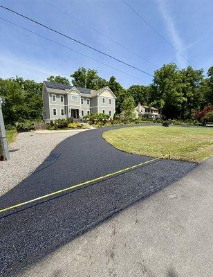 Asphalt driveway sealcoating