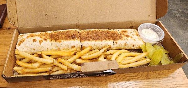 Chicken shawarma wrap, fries, pickles, and toum (garlic sauce)