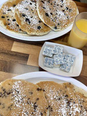 Chocolate Chip Pancakes, OJ, and blueberry pancakes.