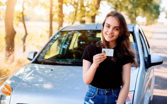 Girl holding license