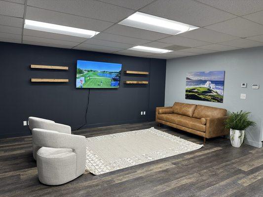 Beautiful lobby area with tv and vending machine.