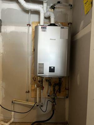 Replacement of existing electric water heater converted to high efficient tankless .