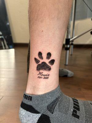 Dog paw tattoo.