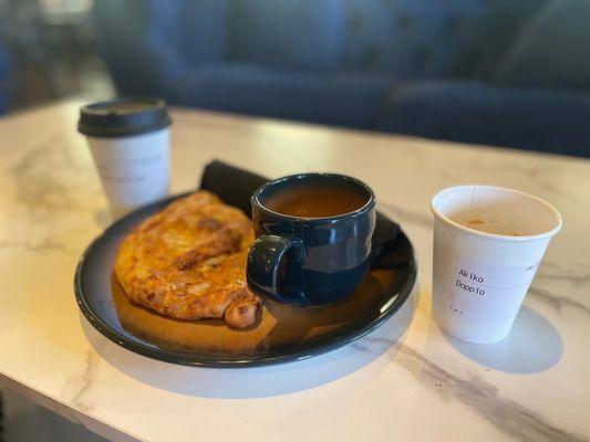 Chicken Masala Calzone with my doppio to the right and spiced apple chai to the left