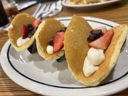 Strawberry, chocolate chip cheesecake mousse pancake tacos.