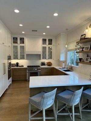 Xtreme built all new upper and lower cabinets, as well as appliance panels (see left). They also built beautiful floating shelves.