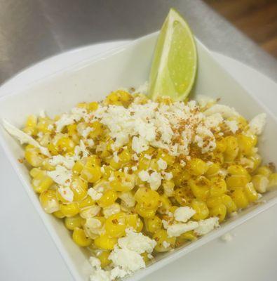 Mexican street corn dip with sour cream, mayonnaise, queso fresco & tajin
