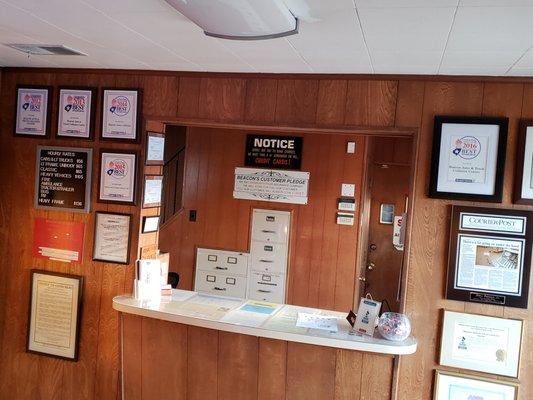 The counter where we will greet you, surrounded by some of our many "Best of's".