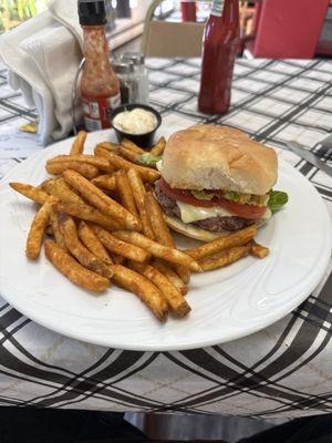 Cheese Burger, well done with fries that are crispy and seasoned.