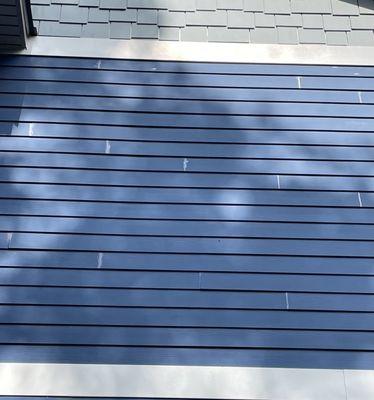 This shows how Hambleton Handyman did not wipe away the excess caulk and allowed it to dry on the surface of my house. At every seam.