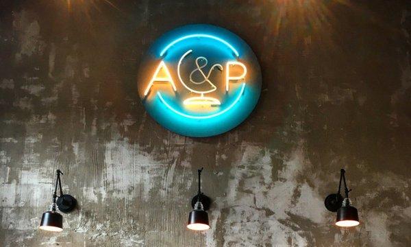 The neon sign above the bar at A&P bar