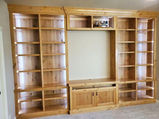 Nampa Idaho craftsman, custom built knotty alder 9' tall by 13' backlit library.