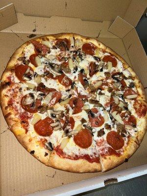 Pepperoni, pineapple, mushroom pizza. Size in photo is large!