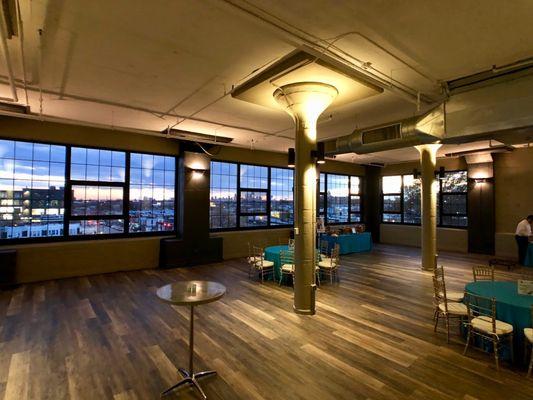 Evenings at The Grindhouse. Wide open space, city views, and a room ready for your next event.