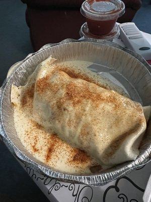 Burrito Texano has steak chicken beef bacon shrimp and fajita vegetables inside.