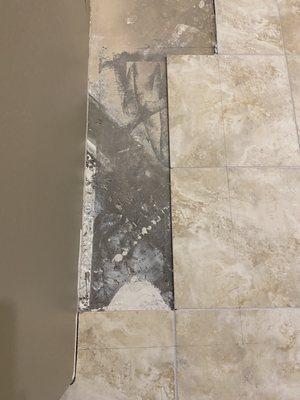 Old peninsula was at an angle. EVF carefully removed cut tiles and old grout without damaging surrounding tiles.