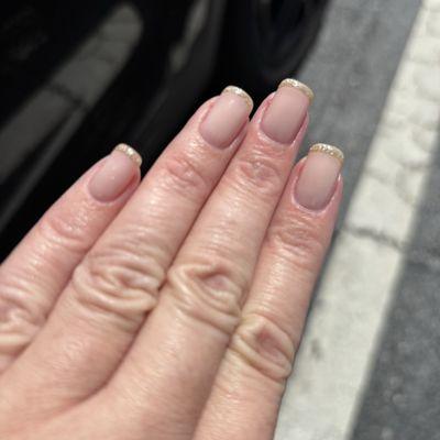 Builder gel with French mani with pale gold tips.