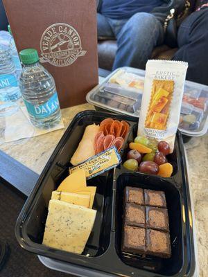 Photo of the meat, cheese, fruit, cracker and brownie plate they give everyone on board as part of your ticket.