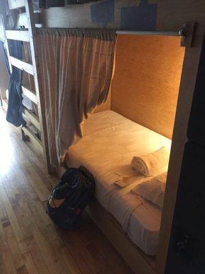 bed comes a curtain, light, outlet, and locker (not in the picture)