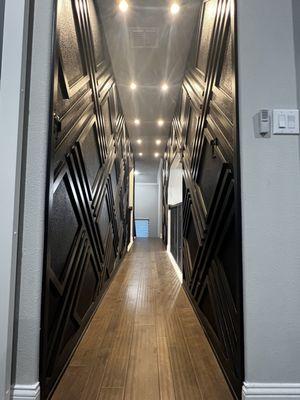 Wooden Accent wall design both sides 
Ceiling Lights across hallway