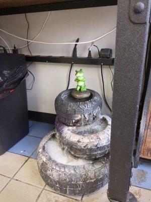 Weird tire frog fountain.