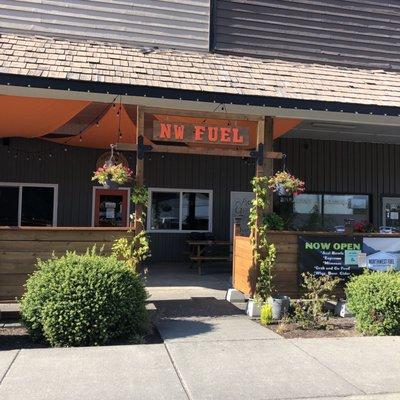 Nice outdoor seating with cute dog grooming spot next door; cutest dog water station ever