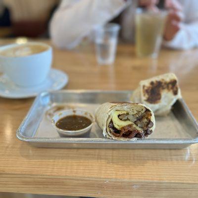 Breakfast burrito w/eggs, potato, bacon (tasty)