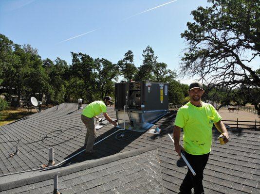 Installing a new 3 ton package on the roof of a home in Palo Cedro.