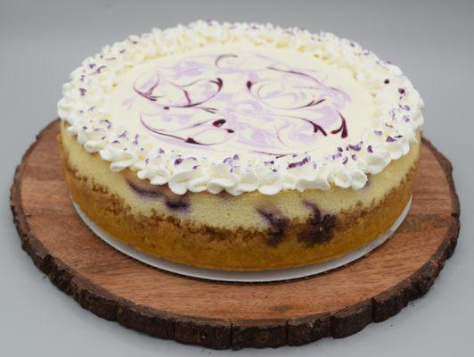Lemon Blueberry cheesecake with a lemon cream topping and whipped cream.