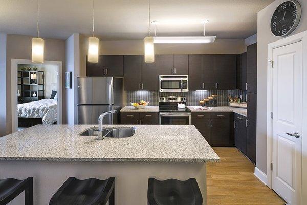 Contemporary kitchen layout is perfect for entertaining