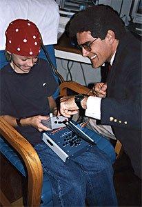 Dr. Matthews, early in his practice. (qEEG pictured)