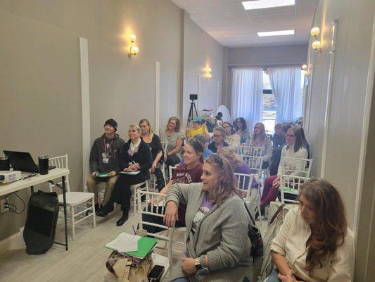 This is the tiny venue with 17 people BECAUSE THE REST LEFT!  BEWARE!  This is what they will stick you with!!  Class, no tables no room!