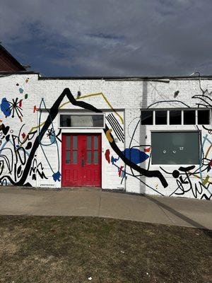 Dust Front exterior entrance. Mural by Ashley Mary Art