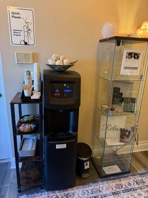 Self serve water, tea and candies are available while you wait.