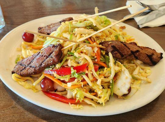 Thai salad with red curry beef skewers. Needs more flavor and a dipping sauce