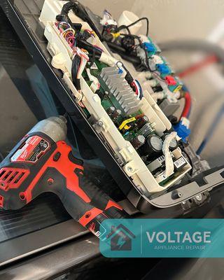 Diagnosing and replacing a faulty control board in a front-load washer. Precision appliance diagnostics and expert repair