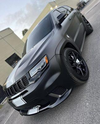 2018 Jeep Track wrapped in Satin Black with Reflective White Stripes, Brakes, Emblems, and Accents. High Gloss Black Rims too.