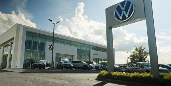 Safford VW Richmond dealership exterior with VW sign and lineup of new models.