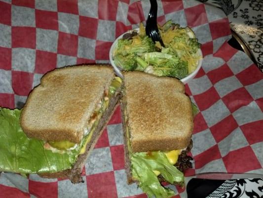 Cheeseburger on wheat toast with broccoli salad