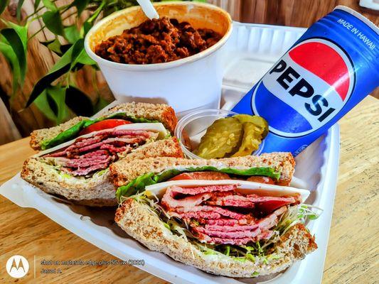 Pastrami Sandwich on Multigrain Bread - served with pickles & Housemade Chili Bowl w/ Rice.