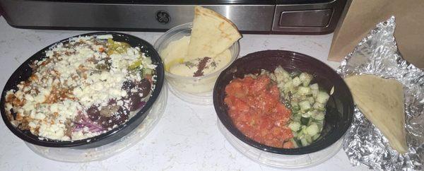 Steak Shawarma with rice bowl, cucumber and tomato salad, and Hummus