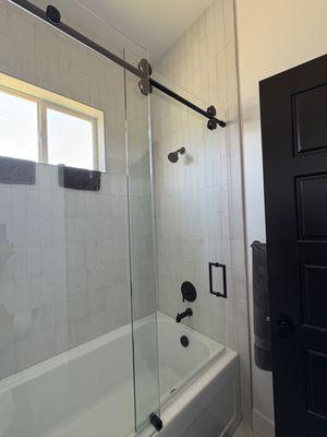 Customer shower enclosure installed on bathtub.