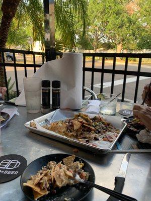 Tin Can Nachos. Unique way to serve a classic. Nice outside patio and good Happy Hour.