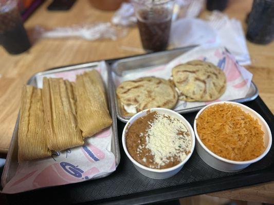 Chicken gorditas, rice, beans & tamales.