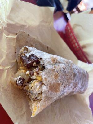 Steak, egg, cheese, potato breakfast burrito