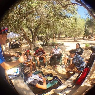 DJ Earwaxxx digging samples with the students