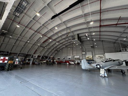 This massive hanger was made of wood, including the massive arches, so that metal was saved for war production in WWII.