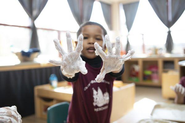 Shaving cream letter drawing in preschool