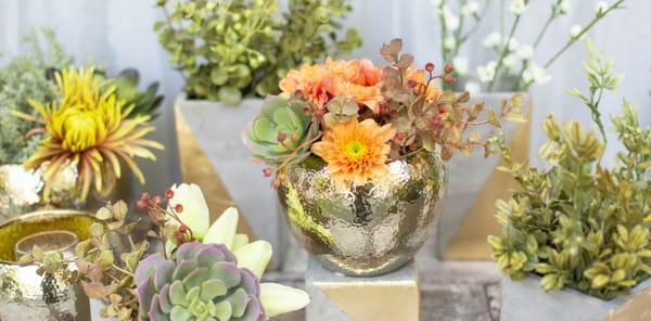 The golden tone of our hammered ceramic planter pots modernizes tablescapes alongside our concrete vases.